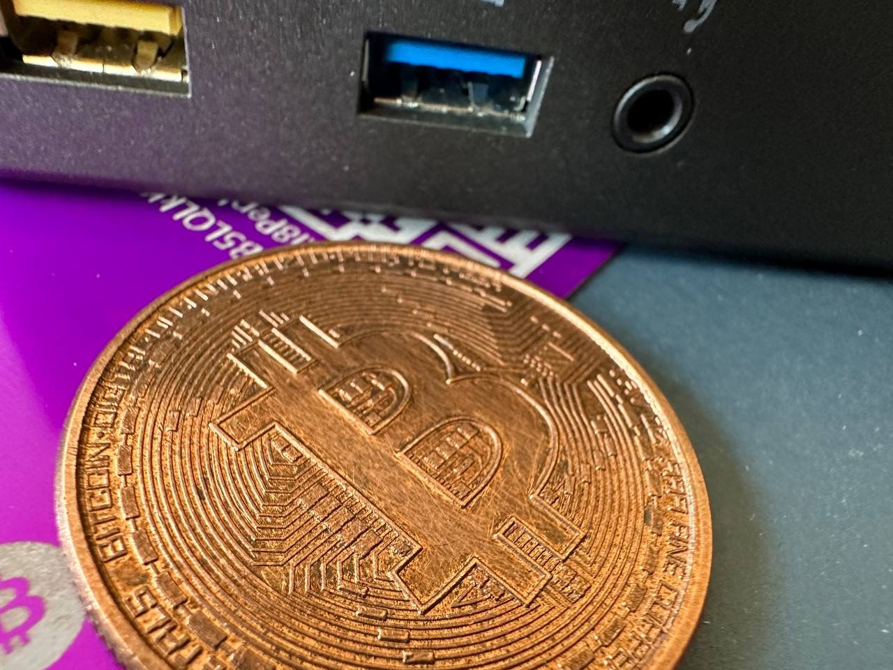 Picture: Bitcoin in front of a mining device