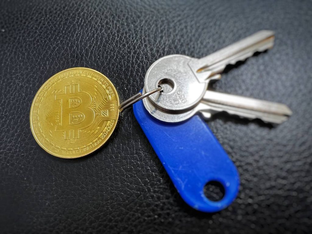 Picture: Bitcoin sign next to keys